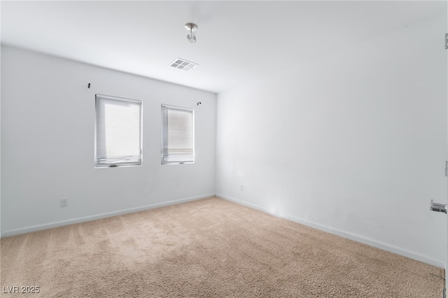 spare room featuring carpet flooring