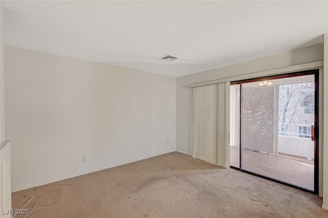 empty room featuring light colored carpet