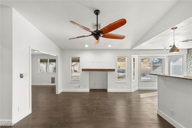 unfurnished living room with ceiling fan, a textured ceiling, and lofted ceiling