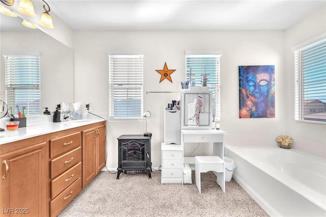 bathroom with vanity and a bathtub