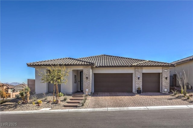 view of front of property with a garage