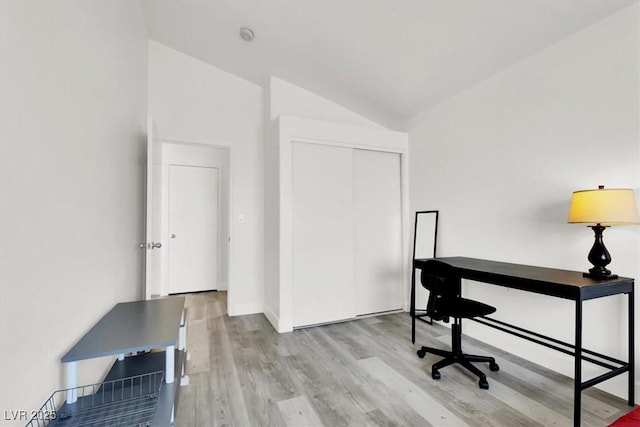 office area featuring light hardwood / wood-style flooring and lofted ceiling