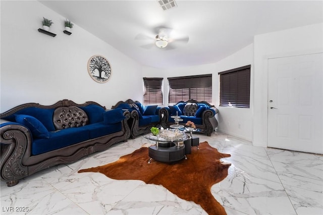 living room with ceiling fan and lofted ceiling