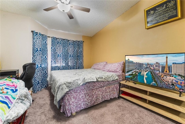 bedroom featuring ceiling fan, a textured ceiling, and carpet flooring