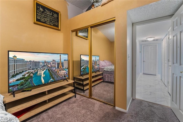 interior space with carpet flooring and a textured ceiling