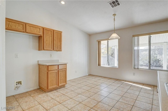 kitchen with decorative light fixtures and light tile patterned floors