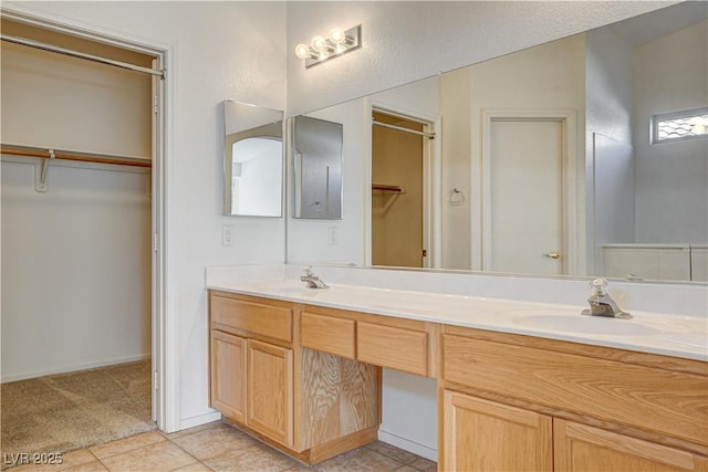 bathroom with vanity and tile patterned flooring