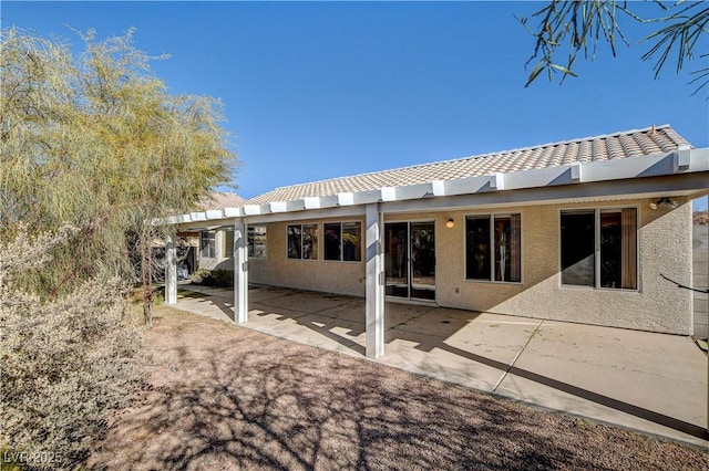 rear view of house featuring a patio area