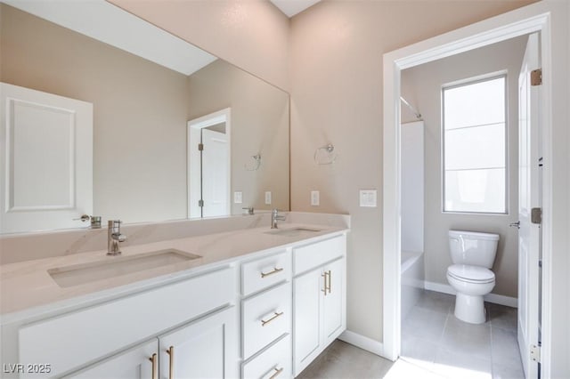 bathroom featuring tile patterned flooring, vanity, and toilet