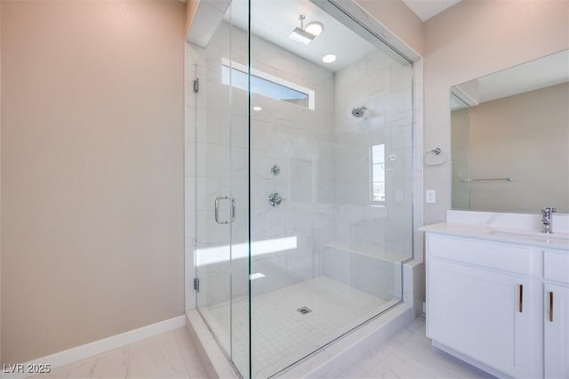 bathroom featuring vanity and a shower with shower door