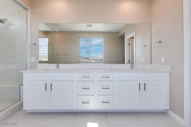 bathroom featuring an enclosed shower and vanity