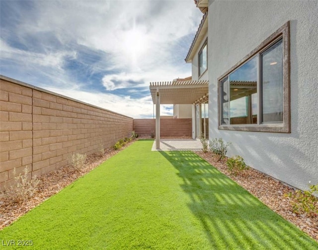 view of yard with a pergola and a patio