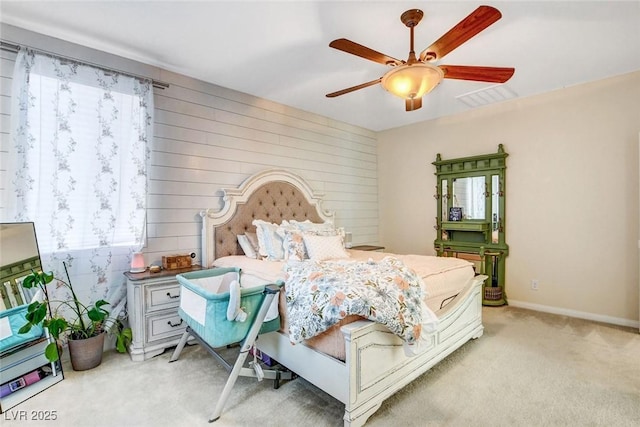 bedroom featuring ceiling fan and light carpet