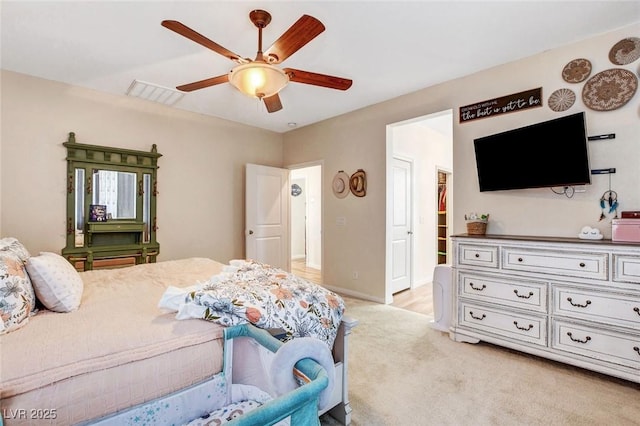 carpeted bedroom featuring ceiling fan