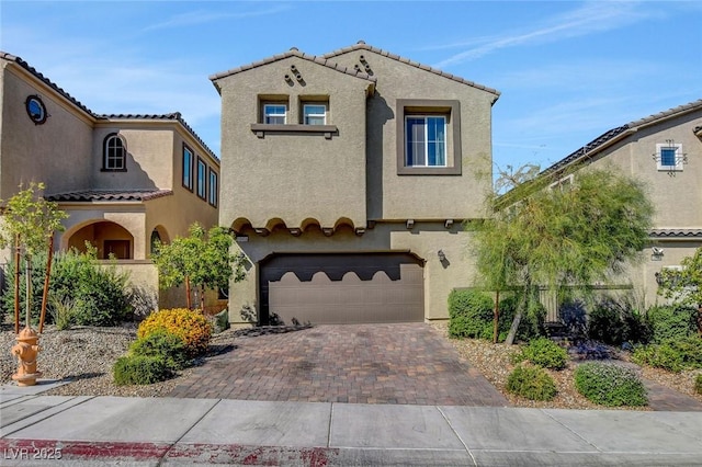 mediterranean / spanish-style home featuring a garage