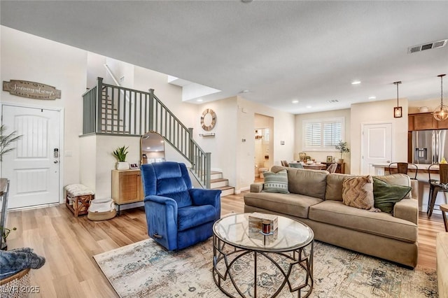 living room with light hardwood / wood-style flooring