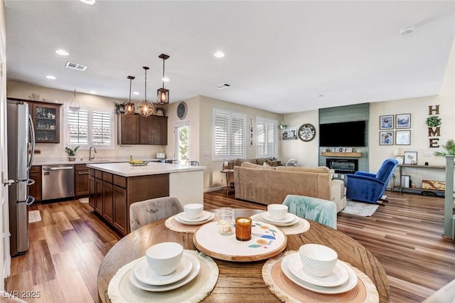 dining area with sink and dark hardwood / wood-style flooring