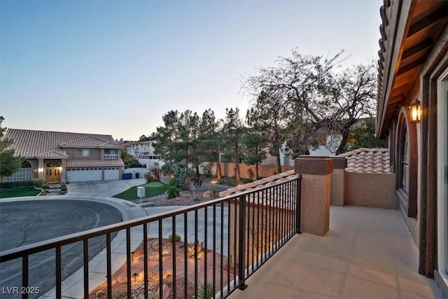 view of balcony at dusk