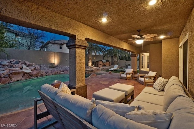 view of patio / terrace featuring ceiling fan, outdoor lounge area, and a fenced in pool