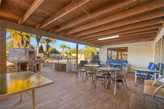 view of patio / terrace featuring an outdoor stone fireplace