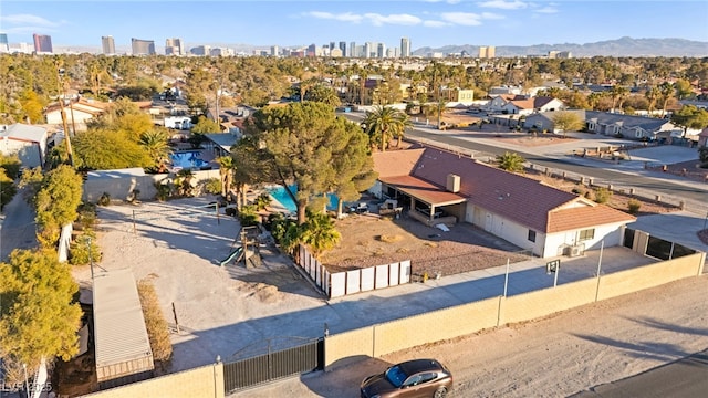 birds eye view of property featuring a mountain view