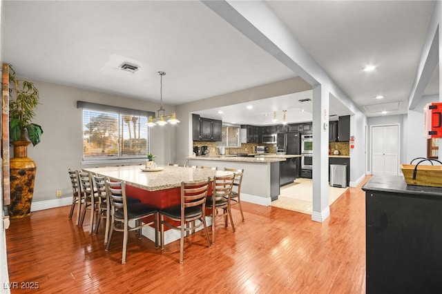 dining area featuring light hardwood / wood-style floors