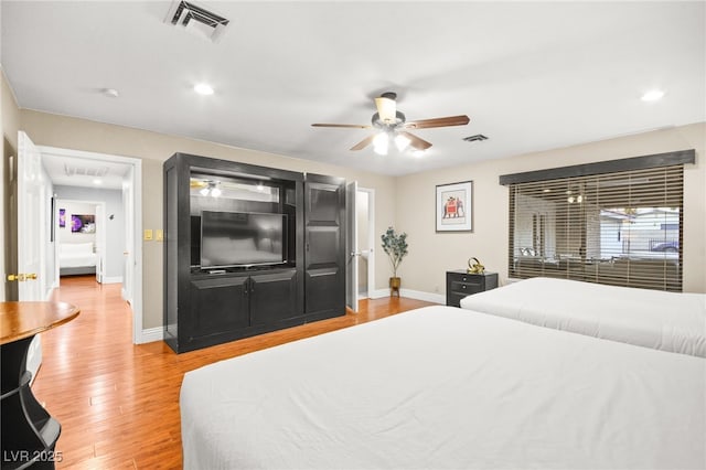 bedroom featuring light wood-type flooring and ceiling fan