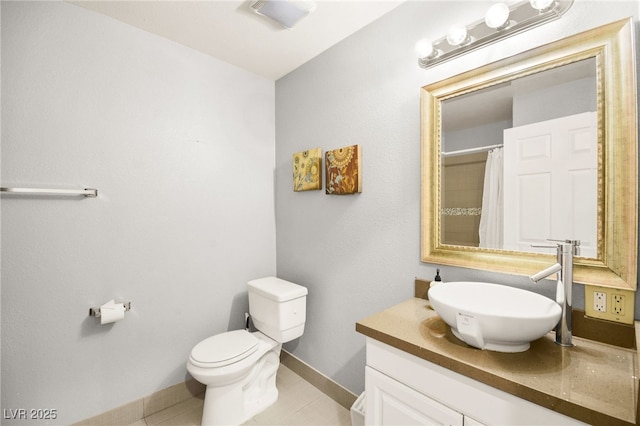 bathroom with curtained shower, toilet, tile patterned floors, and vanity