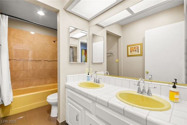 full bathroom featuring vanity, toilet, shower / bath combination with curtain, and tile patterned floors