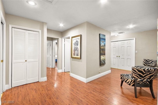 living area with light hardwood / wood-style floors