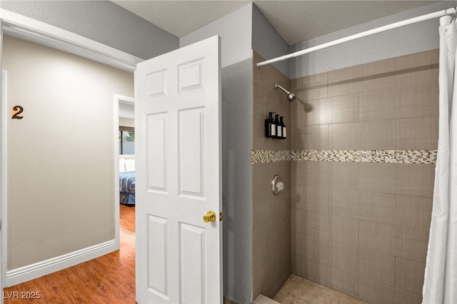 bathroom with wood-type flooring and a shower with curtain