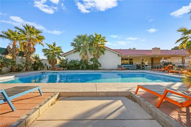 view of pool featuring a patio