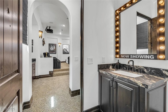 bathroom with vanity and baseboards