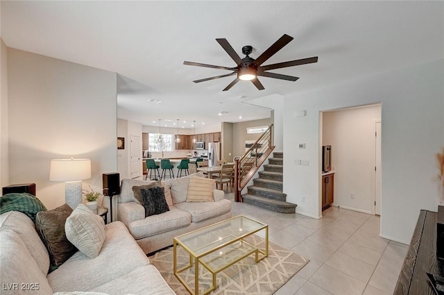 tiled living room with ceiling fan