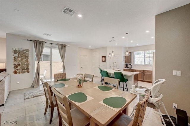 tiled dining space featuring sink