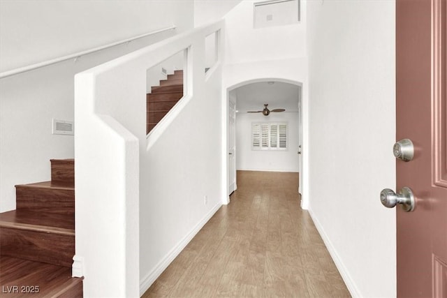 corridor with light hardwood / wood-style flooring