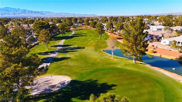 birds eye view of property with a water and mountain view