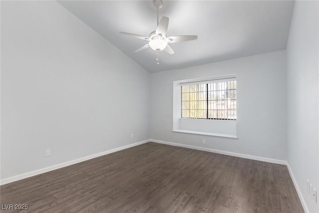 spare room featuring ceiling fan, dark hardwood / wood-style floors, and lofted ceiling