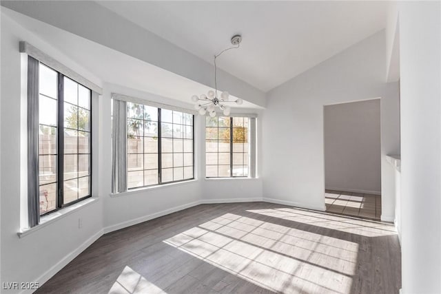 unfurnished dining area featuring ceiling fan, lofted ceiling, and dark hardwood / wood-style flooring