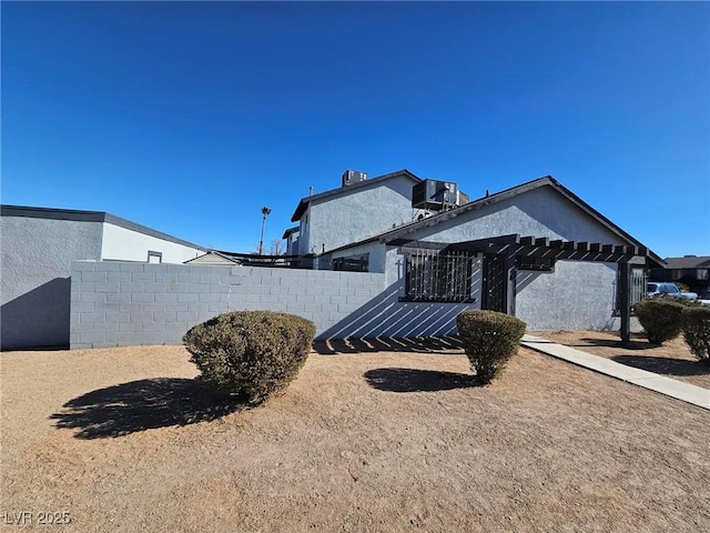 view of home's exterior with central AC unit