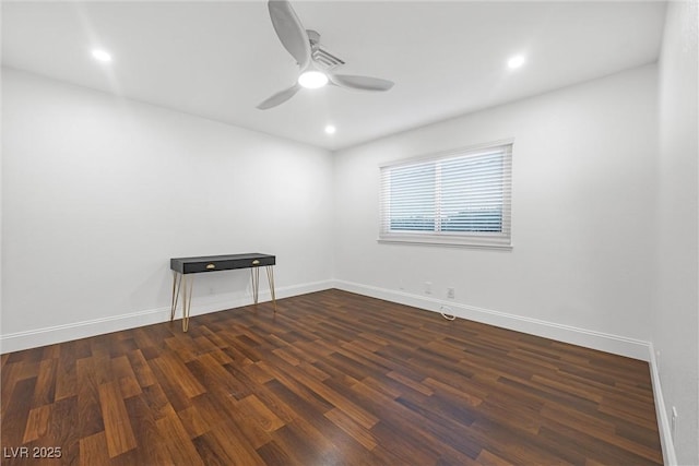 empty room with ceiling fan and dark wood-type flooring