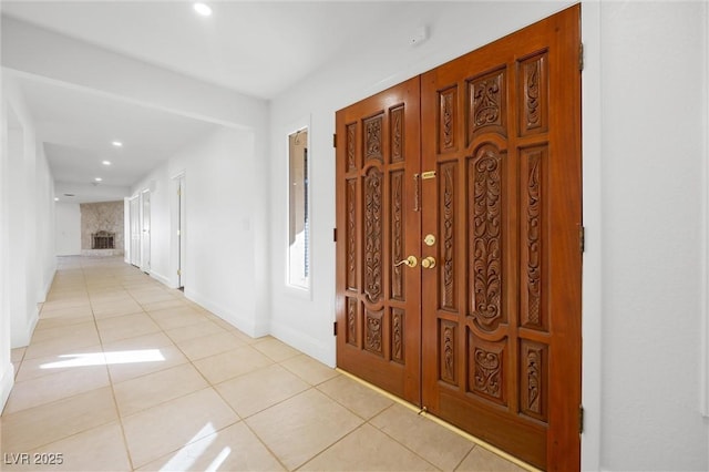 corridor featuring light tile patterned floors