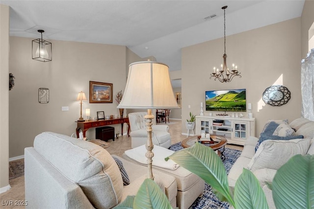 living room featuring a chandelier and lofted ceiling