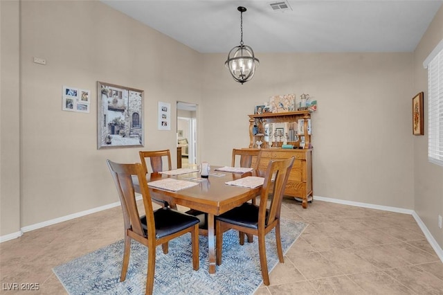 dining space featuring a chandelier