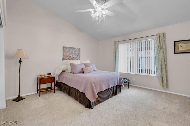 bedroom featuring ceiling fan, vaulted ceiling, and light carpet