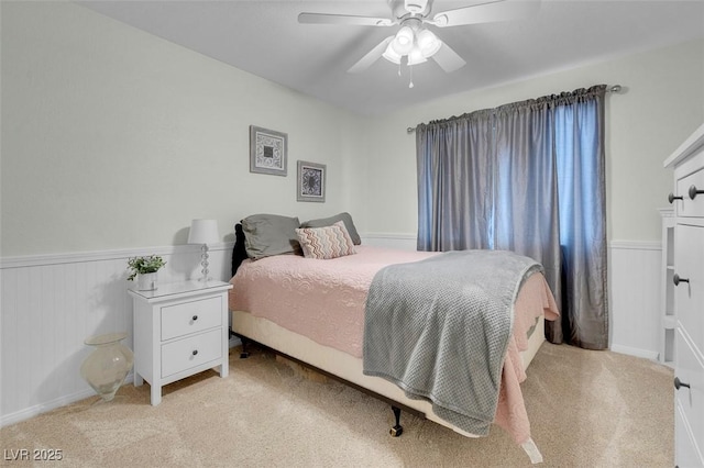 bedroom with ceiling fan and light colored carpet