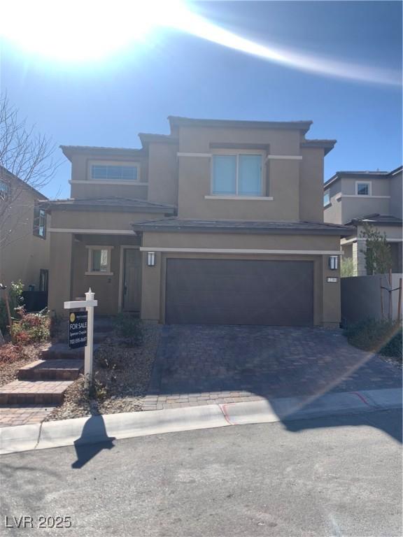 view of front of property with a garage