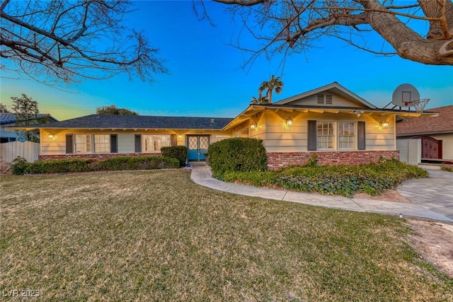 ranch-style house with a yard