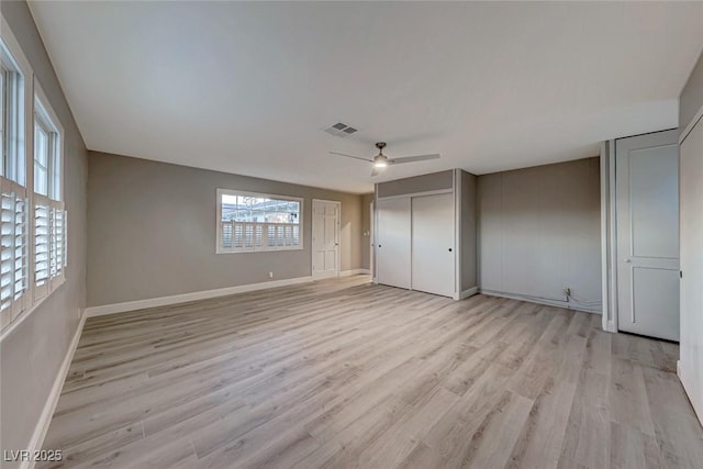 unfurnished bedroom featuring ceiling fan and light hardwood / wood-style floors