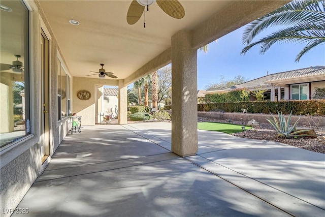 view of patio featuring ceiling fan